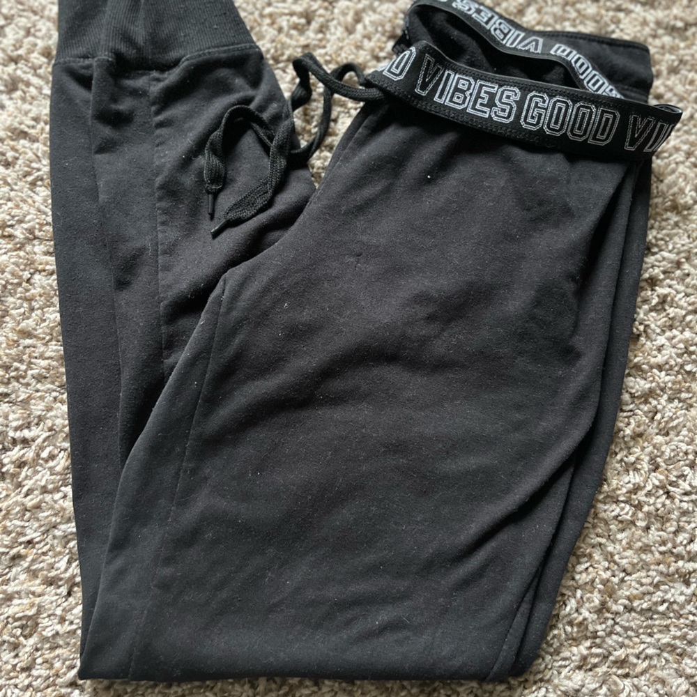 Black joggers. Good vibes band
